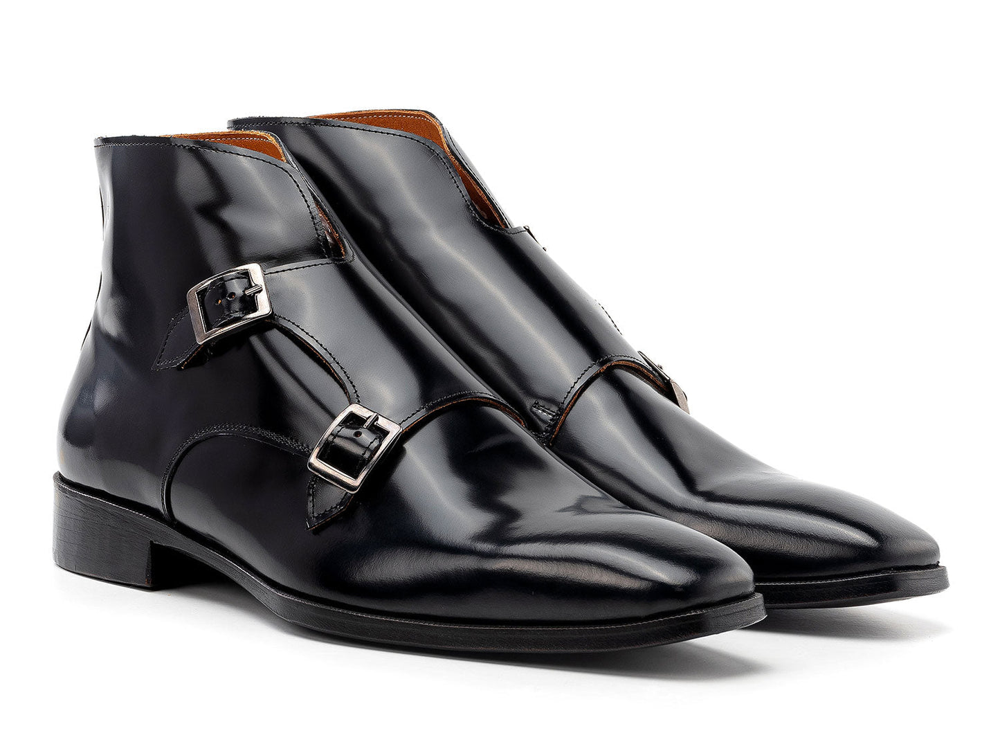 The Paul Parkman Double Monkstrap Ankle Boots in black polished leather (model 8154-BLP) feature side buckles; one men's boot stands upright while the other is balanced on top.