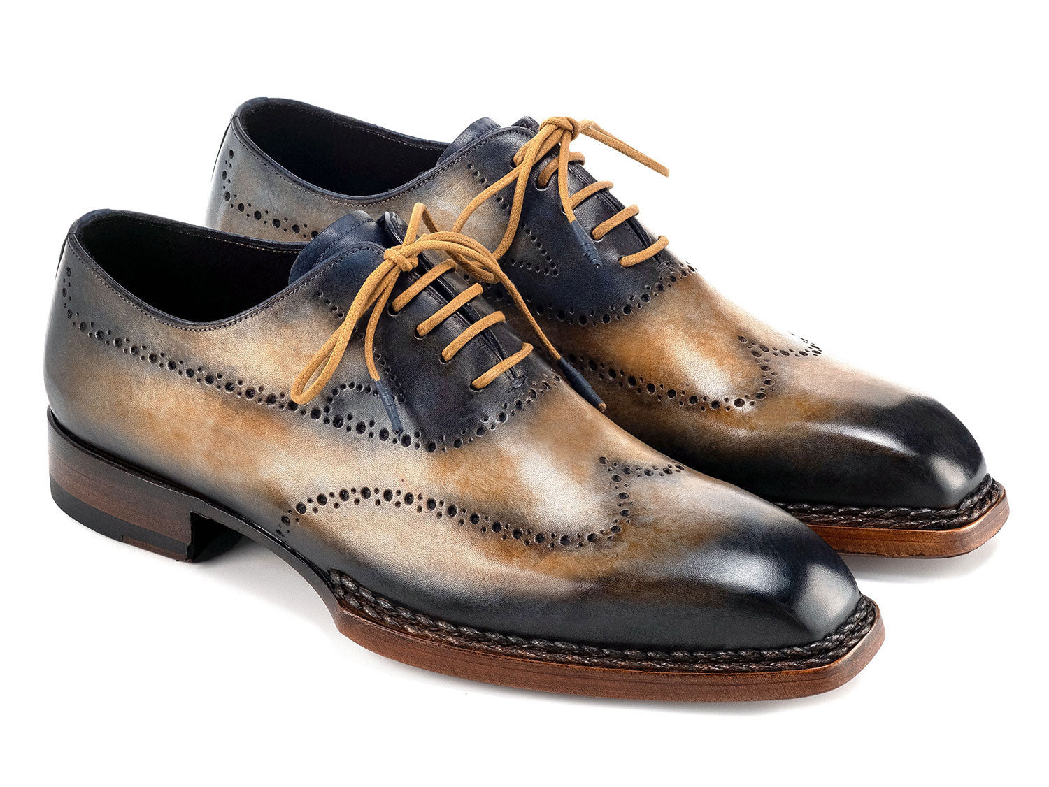 Paul Parkman Goodyear Welted Men's Wingtip Oxfords (Camel & Navy, 81CML62) feature handmade brogue detailing, hand-painted leather, and brown soles. Displayed on a white background.