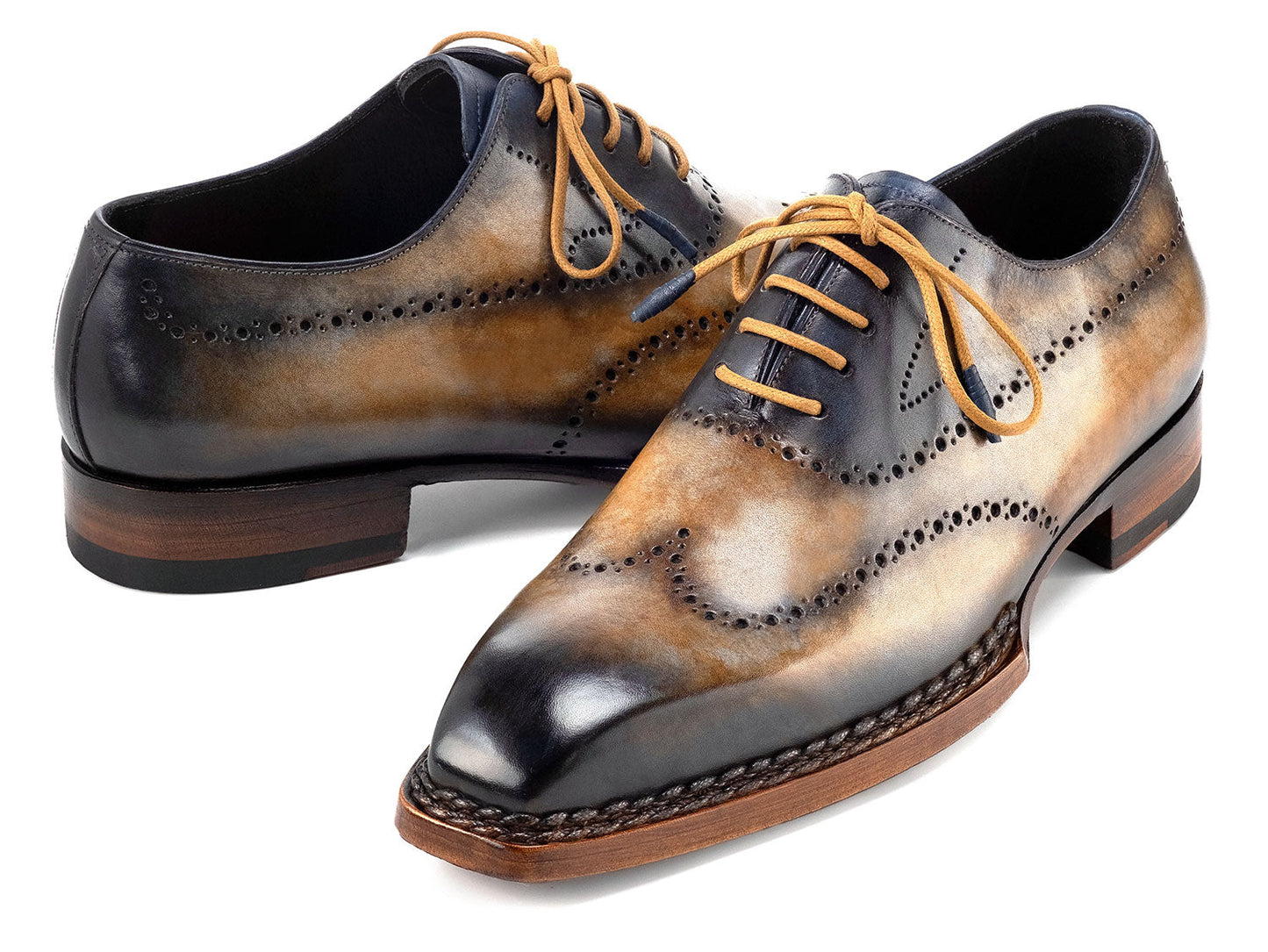 Paul Parkman Goodyear Welted Men's Wingtip Oxfords (Camel & Navy, 81CML62) feature handmade brogue detailing, hand-painted leather, and brown soles. Displayed on a white background.