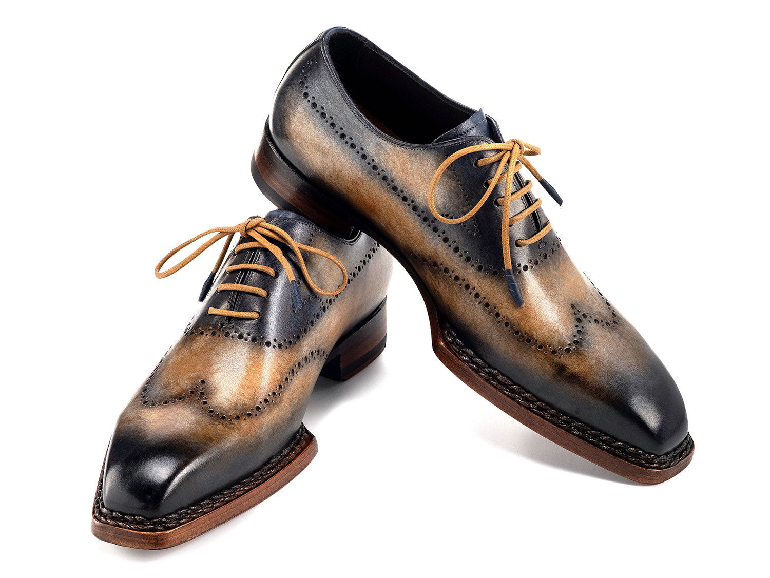 Paul Parkman Goodyear Welted Men's Wingtip Oxfords (Camel & Navy, 81CML62) feature handmade brogue detailing, hand-painted leather, and brown soles. Displayed on a white background.