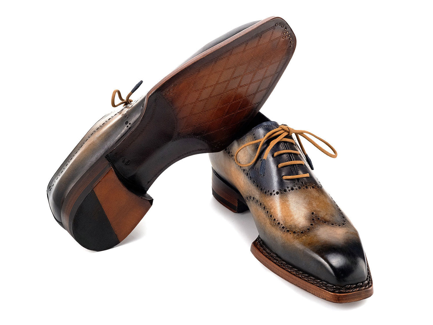 Paul Parkman Goodyear Welted Men's Wingtip Oxfords (Camel & Navy, 81CML62) feature handmade brogue detailing, hand-painted leather, and brown soles. Displayed on a white background.