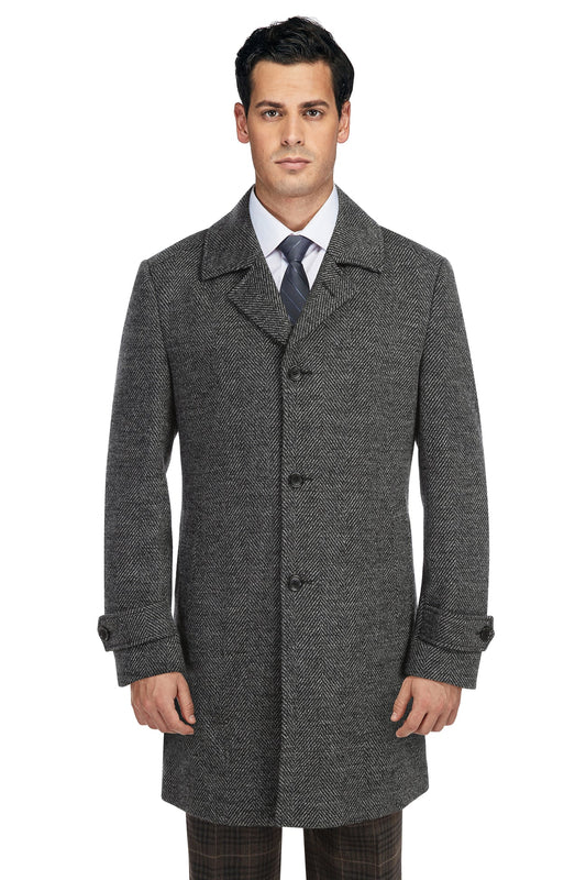 A man wearing the Alessandro Vitello ALESSANDRO VITELLO Charcoal Long Coat 830-7, a white dress shirt, and a striped tie stands against a plain white background.