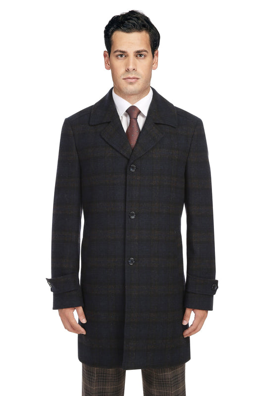 A man wearing an Alessandro Vitello ALESSANDRO VITELLO Navy Long Coat 830-9, a white dress shirt, brown tie, and brown plaid trousers stands facing forward against a white background.