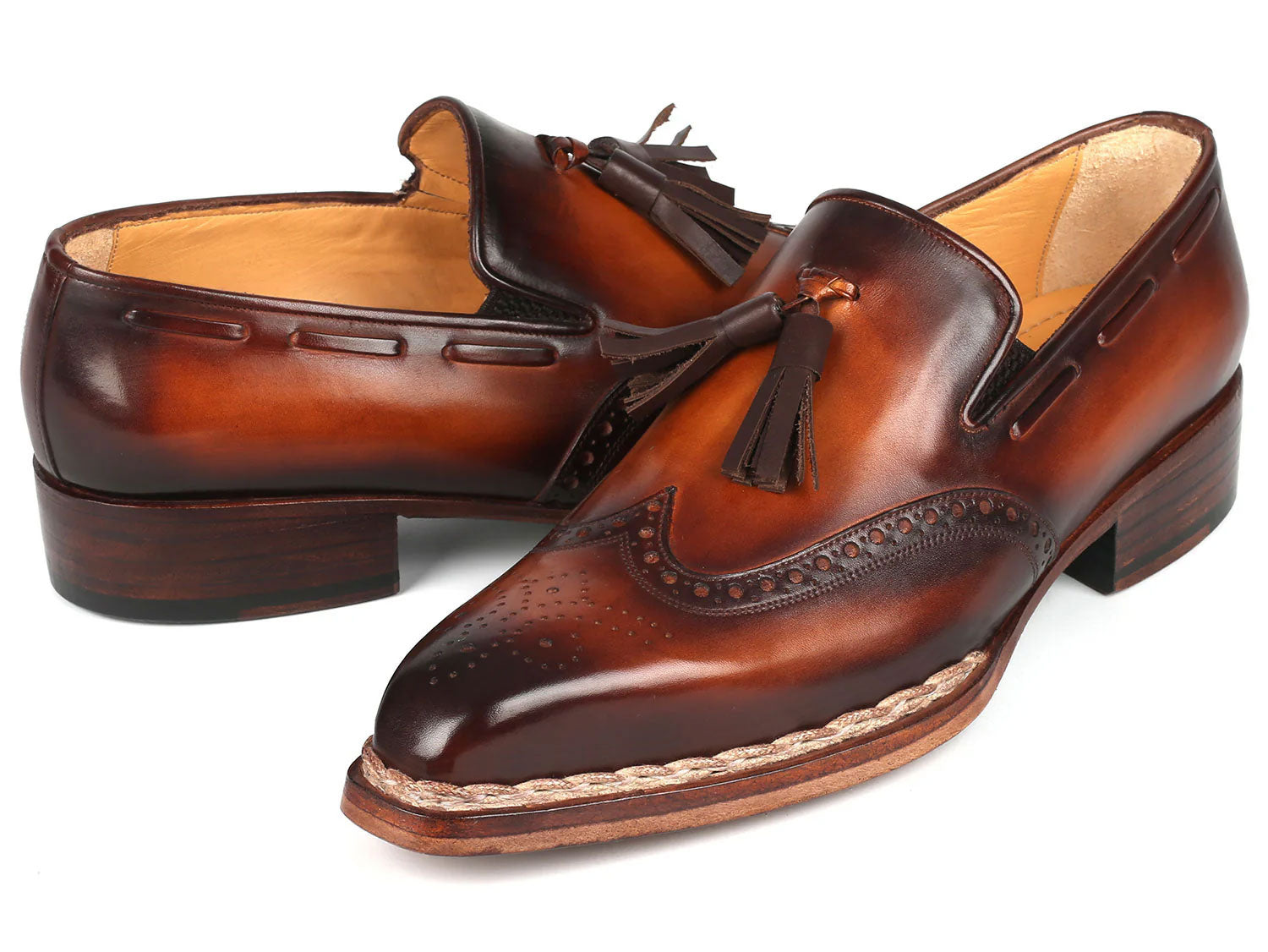 Paul Parkman Norwegian Welted Tassel Loafers Brown Burnished (8507-BRW), handcrafted from hand-painted leather with decorative perforations, braided trim, and stacked heels, shown on a white background.