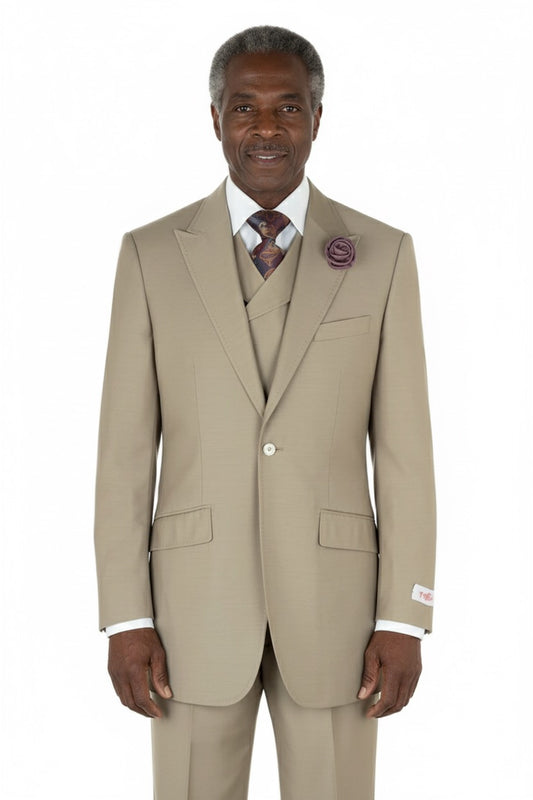 Displayed on a mannequin, the Tiglio Rosso San Giovesse Solid Tan TIG1004 three-piece suit is complemented by a white shirt, patterned tie, and purple lapel flower.