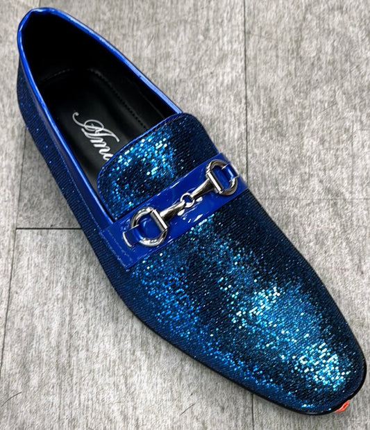 The Exclusive Formal Dress Shoe Blue SUTTON, an elegant shoe by UNIQUE DESIGN MENSWEAR, crafted from genuine leather, rests stylishly on a wooden surface.