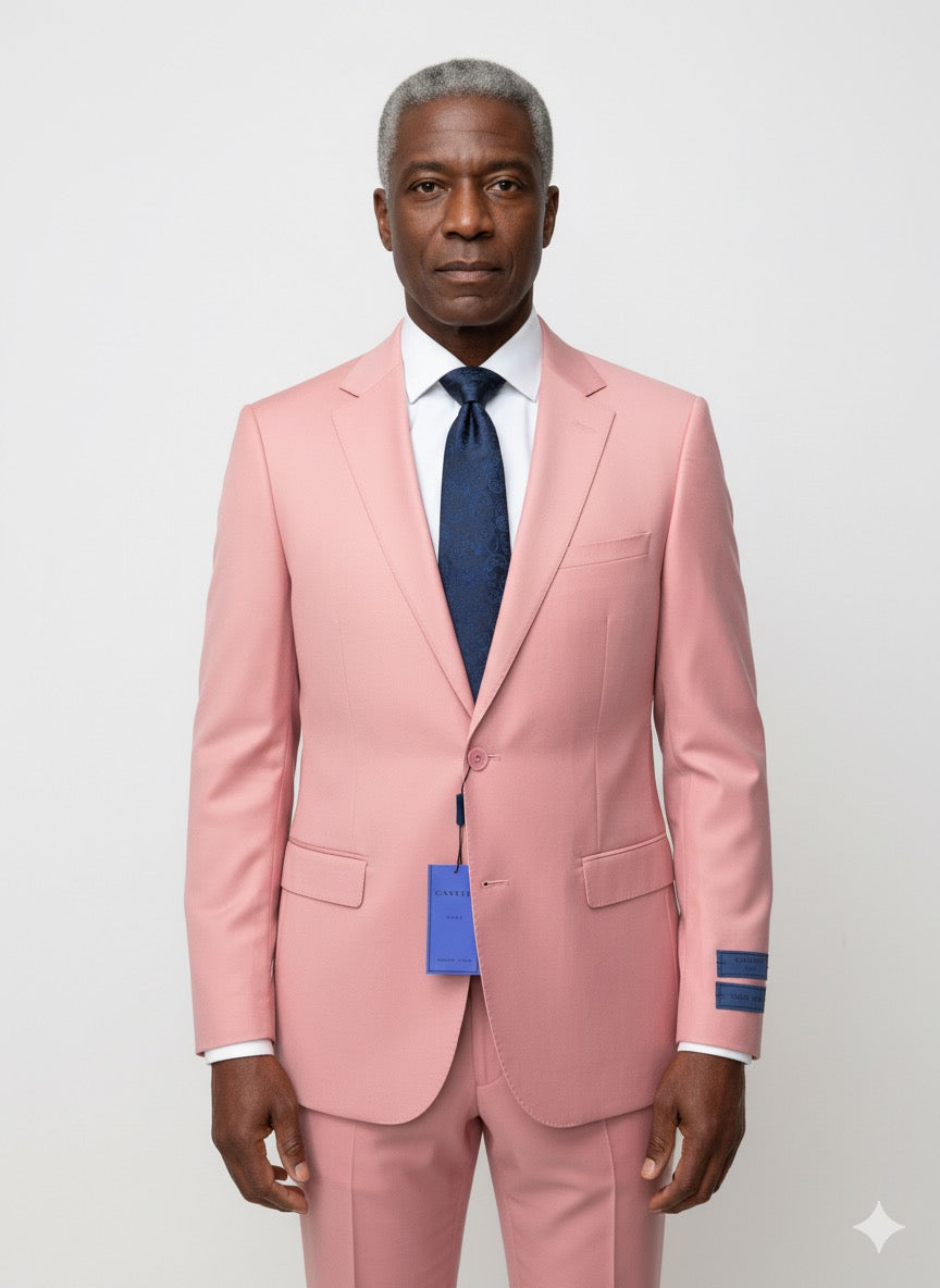 The Cavelli Uomo Porto SLIM FIT Suit 3488/2 in pink by CAVELLI features a notched lapel, two front pockets, and lightweight slim fit. Displayed on a hanger over a wood floor with tags attached to the sleeve and buttonhole. FINAL SALE—NO RETURNS OR EXCHANGES.