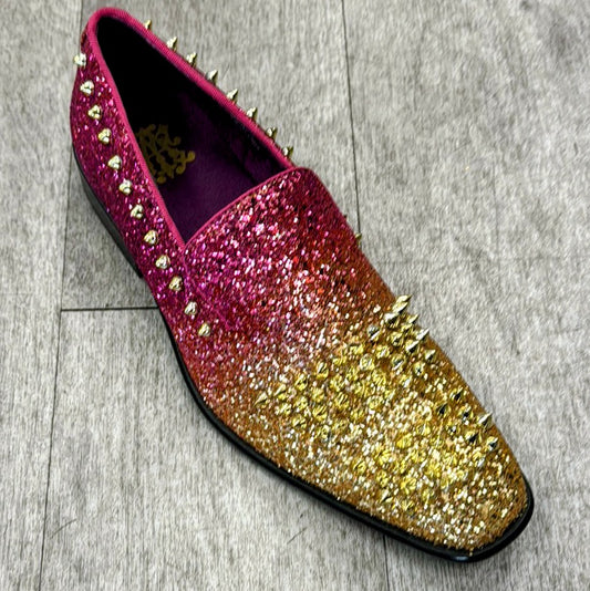 The Exclusive Formal Dress Shoe Red / Gold 6860 by UNIQUE DESIGN MENSWEAR, featuring a shiny multicolored design with genuine leather adorned with spikes and glitter, is displayed on a wooden floor.