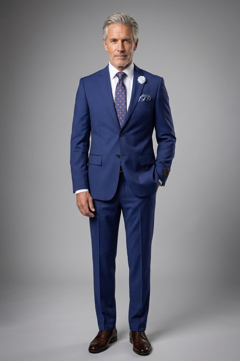 A mannequin dressed in the Tiglio Luxe Novello Modern Fit French Blue suit from Unique Design Menswear, perfectly complemented by a white shirt, patterned tie, pocket square, and a white lapel flower exudes artistry and sophistication.