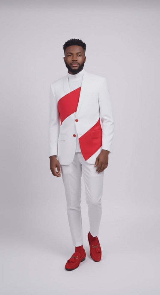 A man wears the Unique Design Menswear Custom Prom Suit in white with red wrap accents and red shoes, standing against a plain light background.