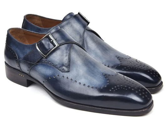 The Paul Parkman Wingtip Single Monkstraps Navy - 98F54-NVY are handmade navy leather shoes with wingtip perforations and a buckle closure, displayed on a white background.