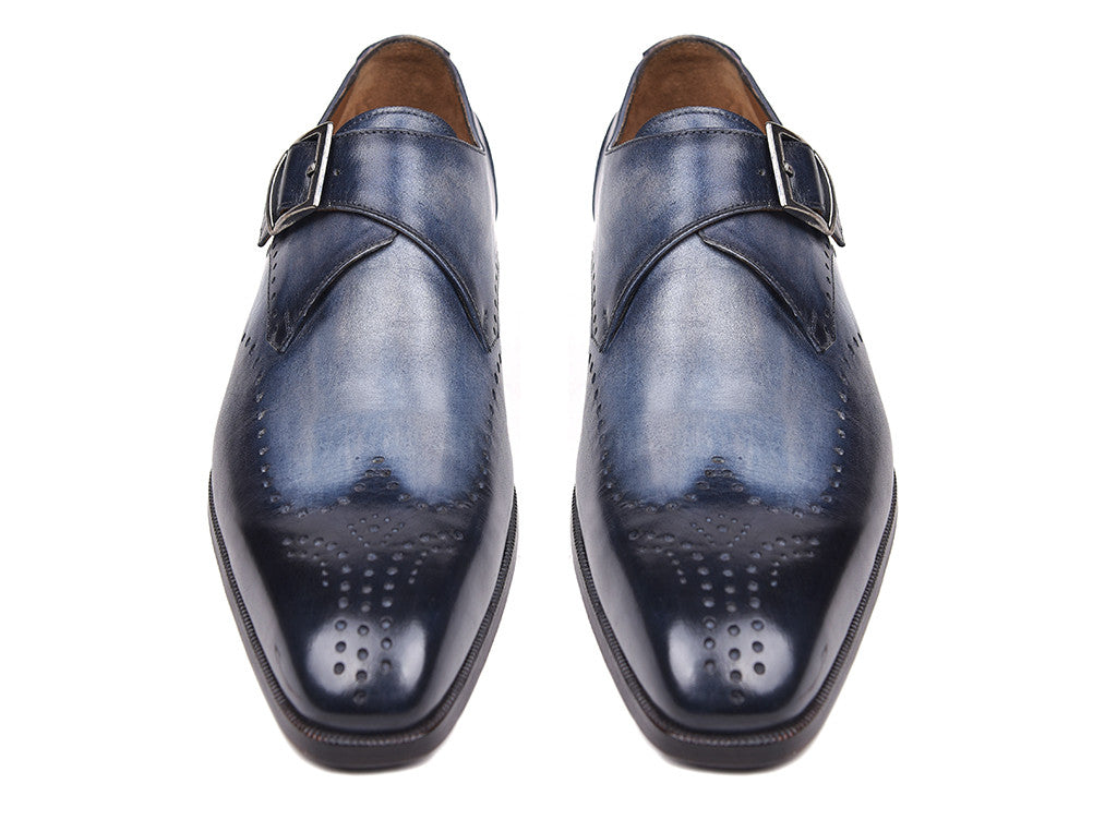 The Paul Parkman Wingtip Single Monkstraps Navy - 98F54-NVY are handmade navy leather shoes with wingtip perforations and a buckle closure, displayed on a white background.