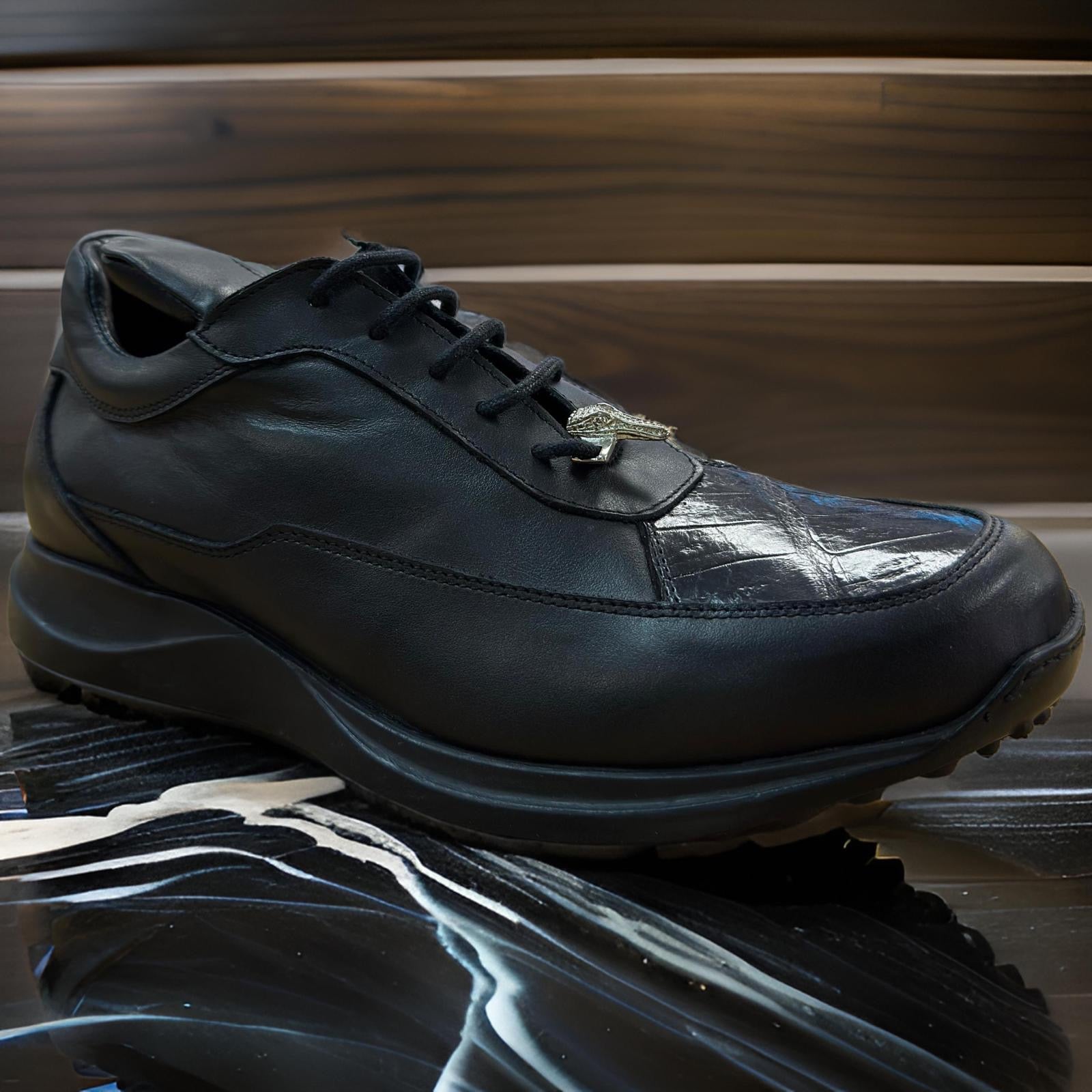 The Mauri 8900 Black Shoes, available in sizes 7.5, 8.5, and 11, feature a textured sole and reflective details, custom crafted for perfection and displayed against a wooden backdrop.