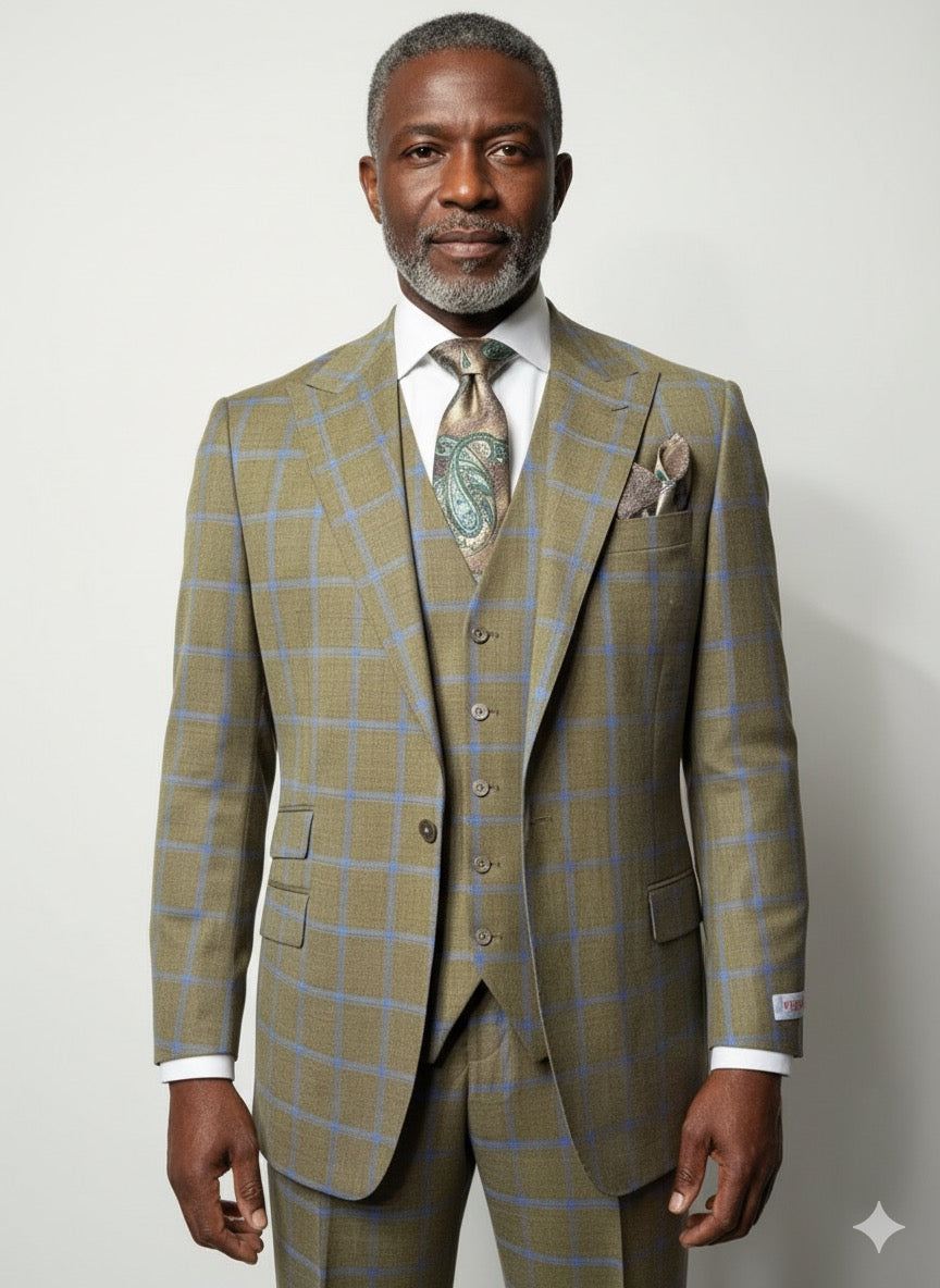A tailored mannequin showcases the Tiglio Rosso Portofino Semi Wide Leg TL8068 suit in tan checkered 100% wool with matching vest, tie, and pocket square, set against a wall with abstract shadow patterns.