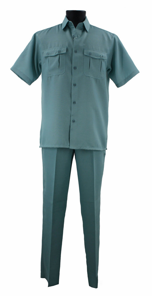 A mannequin is showcasing the Bassiri Light Teal 2pc Set A 138, a stylish ensemble featuring a short-sleeve button-up shirt with two chest pockets, crafted from polyester, paired with matching trousers.