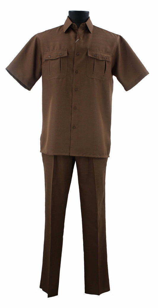 The Bassiri Toast 2pc Set A 138, featuring a brown short-sleeve button-up shirt and matching pants crafted from stylish polyester material, is elegantly displayed on a mannequin against a crisp white background.