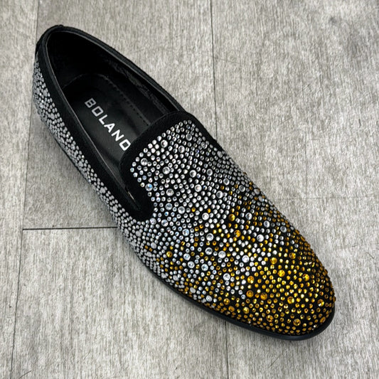 An Exclusive Formal Dress Shoe from UNIQUE DESIGN MENSWEAR, featuring a gradient design of black, silver, and gold rhinestones crafted with genuine leather, is displayed elegantly on the gray tiled floor.