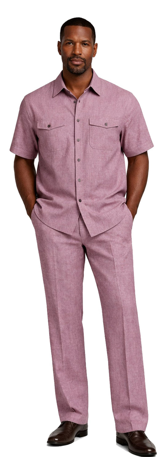 A man stands with hands in pockets, wearing the Bassiri Burgundy 2pc Set A 145—a short-sleeve button-up shirt and matching trousers by Bassiri—paired with brown shoes.