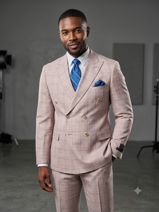 A man wearing the Tiglio Luxe PISTOIA Modern Fit Blue Windowpane Double Breasted Suit by Tiglio stands in a studio with a neutral gray background, his look completed by a coordinating blue tie and pocket square.