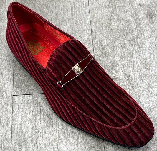The Exclusive Formal Dress Shoe Burgundy 6946 by UNIQUE DESIGN MENSWEAR (SIZE 13 ONLY), features maroon velvet with a ribbed texture, red interior, and a decorative metal and stone accent, crafted in Italy and shown on a light-tiled floor.