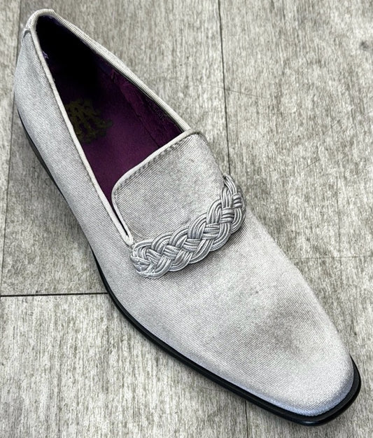 The Exclusive Formal Dress Shoe in Grey Solid 6845 by UNIQUE DESIGN MENSWEAR features a silver velvet finish with braided detailing, complemented by a black sole. Expertly crafted in Italy with genuine leather, these loafers are the epitome of elegance and sophistication.