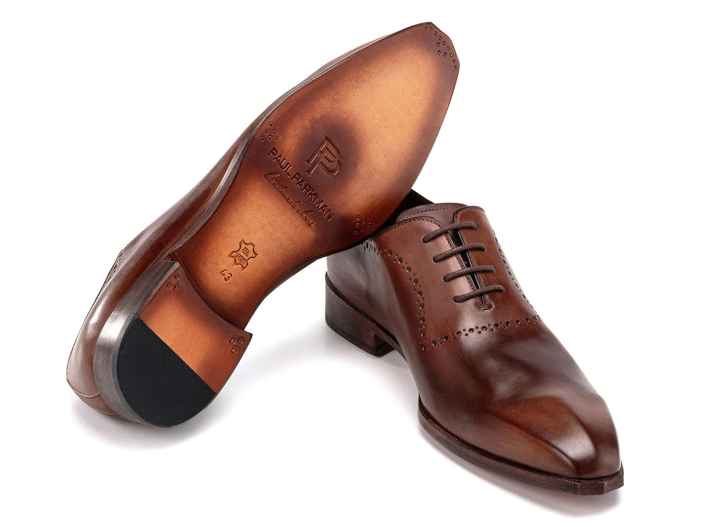 The Paul Parkman Antique Brown Oxfords (AG444BRW) are men's handmade oxford shoes crafted from brown calfskin leather with closed lacing and decorative perforations, shown against a white background.
