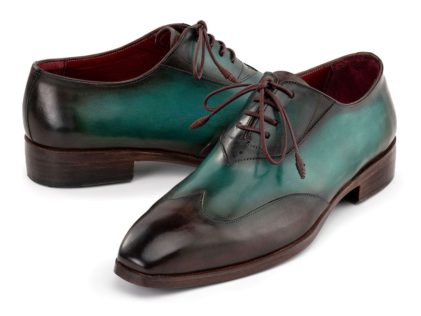 The Paul Parkman Brown & Green Patina Leather Wingtip Oxford Shoes (AL3257SJ) feature a hand-painted green and brown leather finish, brown laces, and dark brown soles.