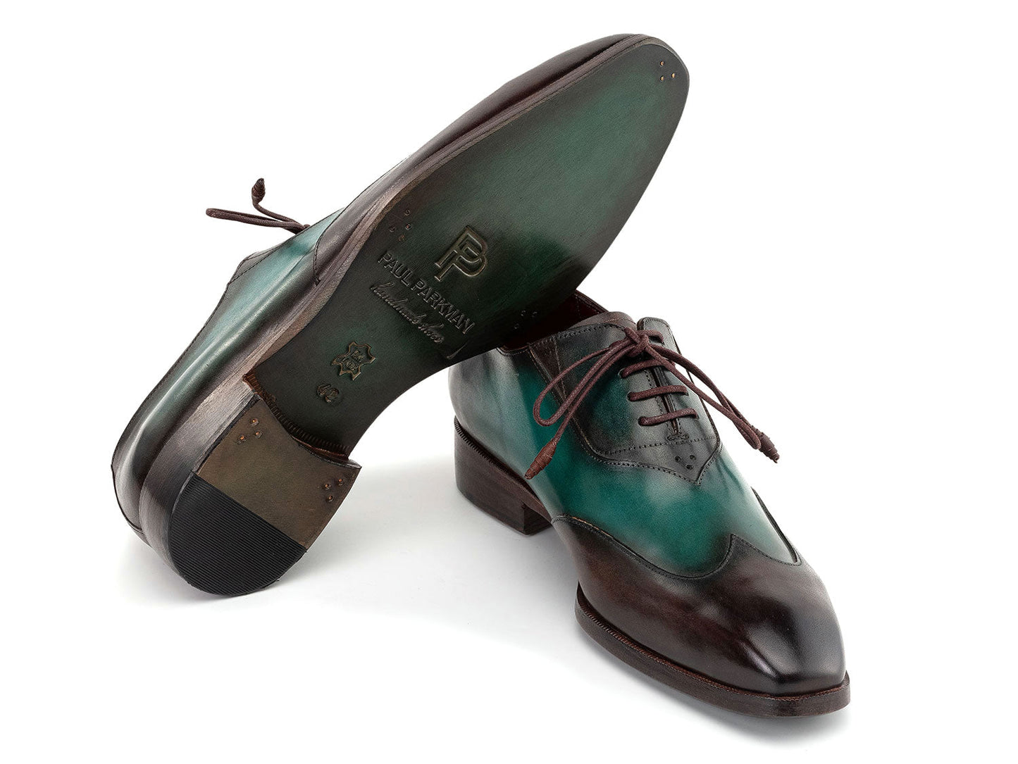 The Paul Parkman Brown & Green Patina Leather Wingtip Oxford Shoes (AL3257SJ) feature a hand-painted green and brown leather finish, brown laces, and dark brown soles.