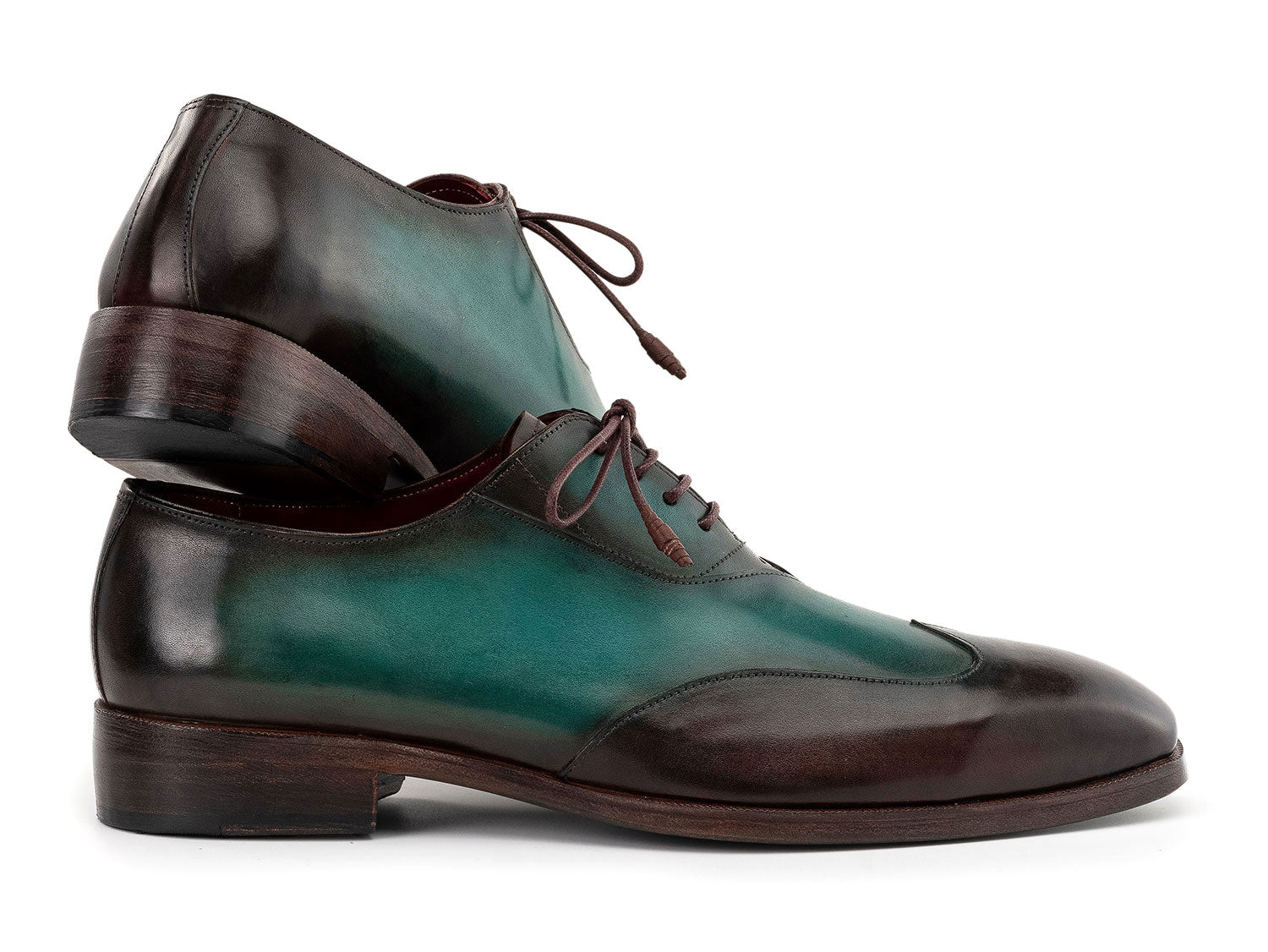 The Paul Parkman Brown & Green Patina Leather Wingtip Oxford Shoes (AL3257SJ) feature a hand-painted green and brown leather finish, brown laces, and dark brown soles.