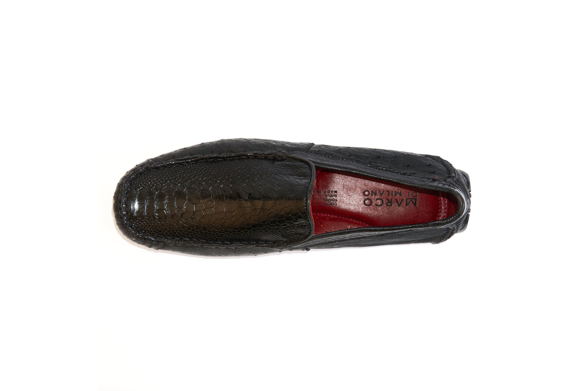 A pair of Marco Di Milano Alba Black luxury moccasin loafers—one upright and the other leaning against it—showcasing detailed stitching and a sole expertly crafted from genuine ostrich leather for an unmistakably exotic driver style.