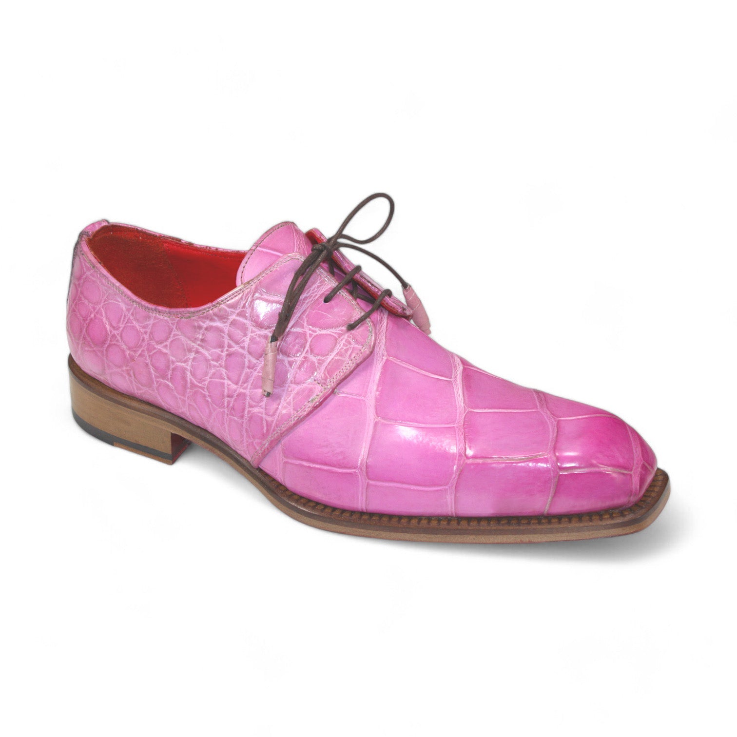 The Fennix Alexander Pink by Fennix of Italy is a handcrafted pink genuine alligator leather dress shoe with a lace-up design, brown sole, and red interior, displayed on a white background.