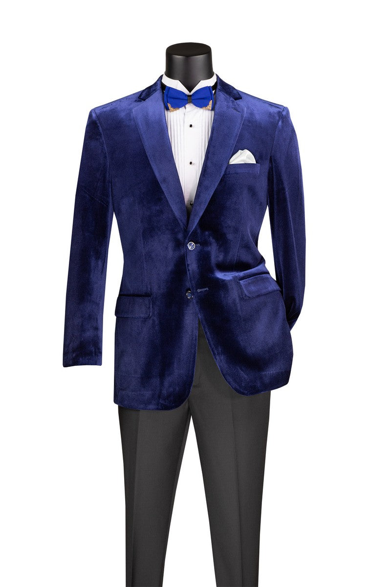 Vinci Suits Velvet Regular Fit Fashion Jacket Sapphire B-27, a single-breasted blue velvet jacket with a notch lapel, worn with a white pleated shirt, blue bowtie, white pocket square, and dark trousers.