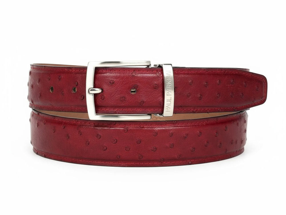 Paul Parkman Men's handmade genuine ostrich skin belt in red (B04), featuring a silver buckle and subtle textured dots, coiled in a single loop.