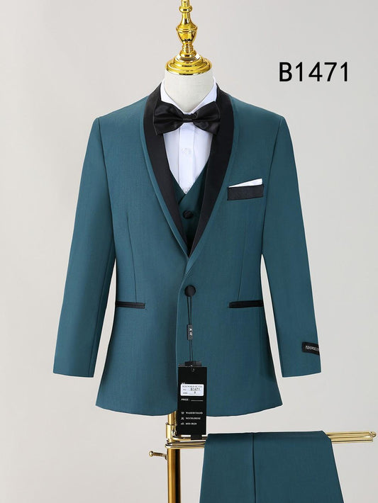 Unique Design Menswear BOY SUIT 5-PC SET B1471: teal boys’ tuxedo with black satin lapels, black bow tie, white shirt, pocket square on mannequin; trousers displayed below. Perfect for formal occasions.