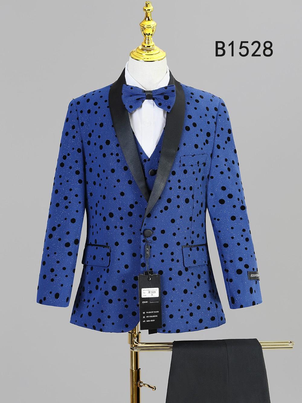 The BOY SUIT 5-PC SET B1528 by Unique Design Menswear features a blue polka dot jacket with black satin lapels, matching bow tie and vest—stylishly displayed on a mannequin.