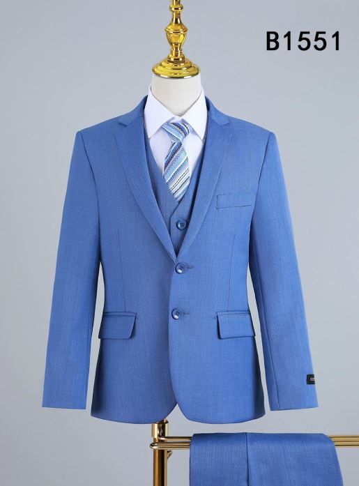Unique Design Menswear's BOY SUIT 5-PC SET B1551 (IN STORE) is showcased on a mannequin, featuring a light blue suit with matching trousers, a white dress shirt, and blue striped tie. Product code "B1551" appears in the top right corner.
