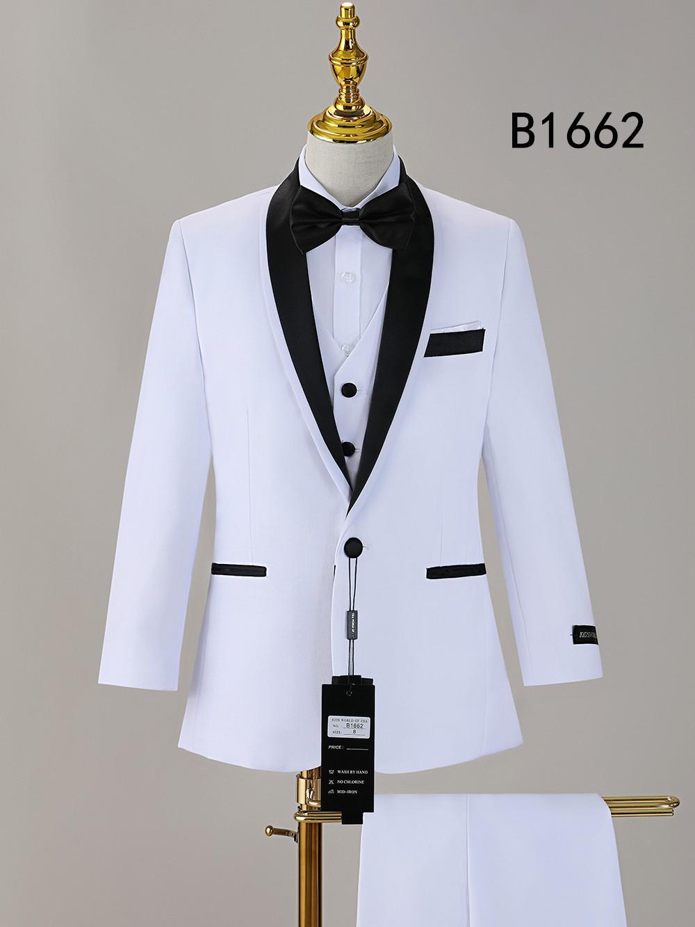 Displayed on a mannequin, the BOY SUIT 5-PC SET B1662 by Unique Design Menswear features a white tuxedo jacket with black lapels, buttons, and pocket accents, completed with matching pants and bow tie. The code "B1662" appears in the background.