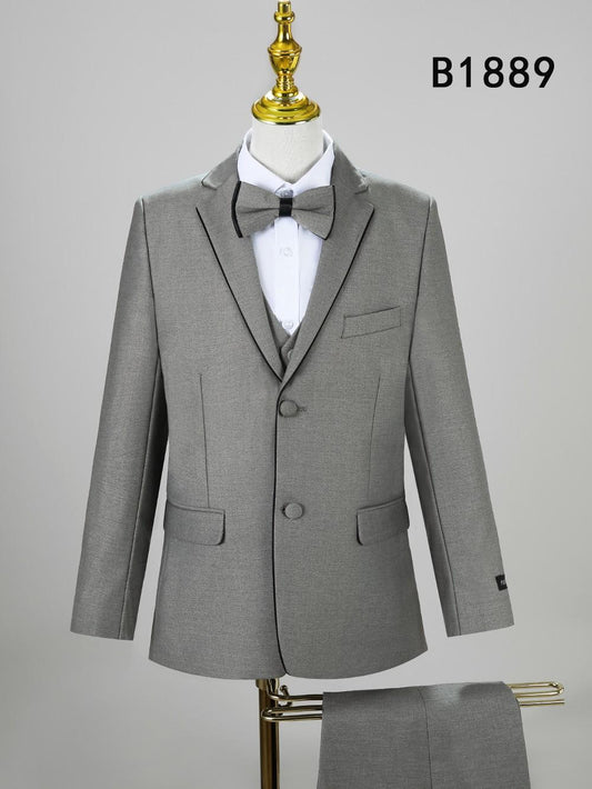 The Unique Design Menswear BOY SUIT 5-PC SET B1889 features a stylish gray three-piece suit with bow tie, ideal for boys’ formal wear. Displayed on a mannequin with pants below and code B1889 in the top right corner.