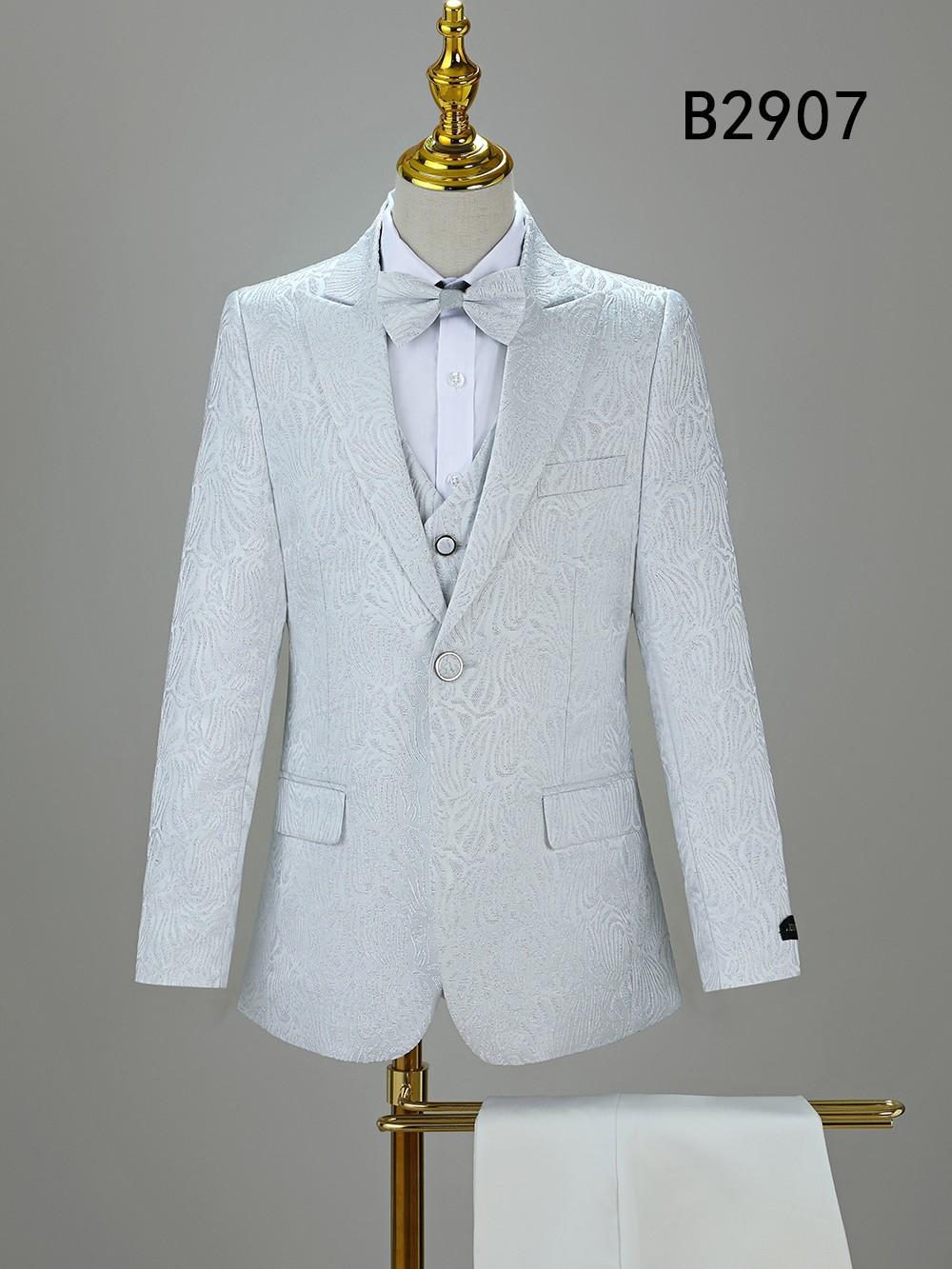The BOY SUIT 5-PC SET B2907 by Unique Design Menswear, featuring a white textured suit with matching vest, dress shirt, and bow tie, is displayed on a mannequin with code B2907 shown in the top right corner.
