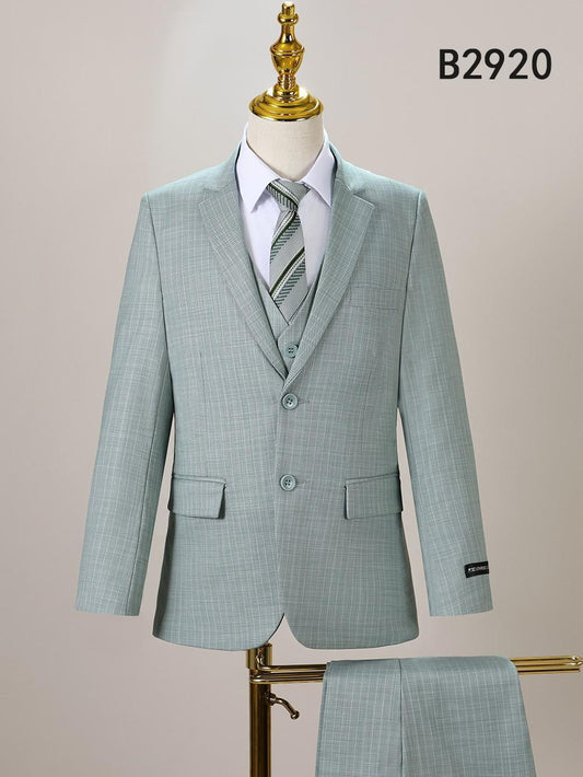 The Unique Design Menswear BOY SUIT 5-PC SET B2920 is shown in light green with a subtle check pattern, styled on a mannequin with a white shirt and striped tie, and matching trousers displayed nearby.