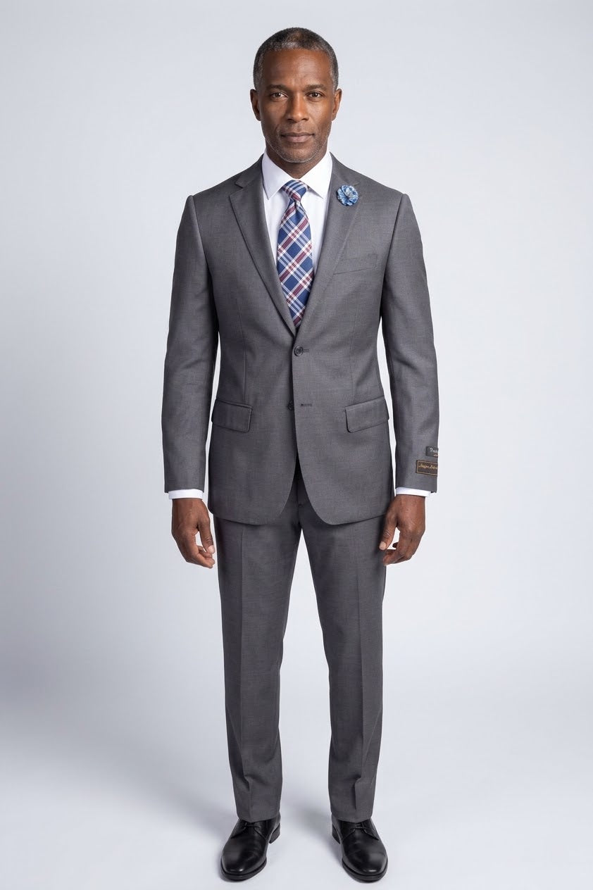 The Tiglio Luxe Novello Medium Gray Pure Wool Men’s Suit TIG1008 features a white dress shirt, striped tie, blue flower lapel pin, and a left sleeve label—Tiglio Luxe luxury fashion for men, displayed on a headless mannequin.