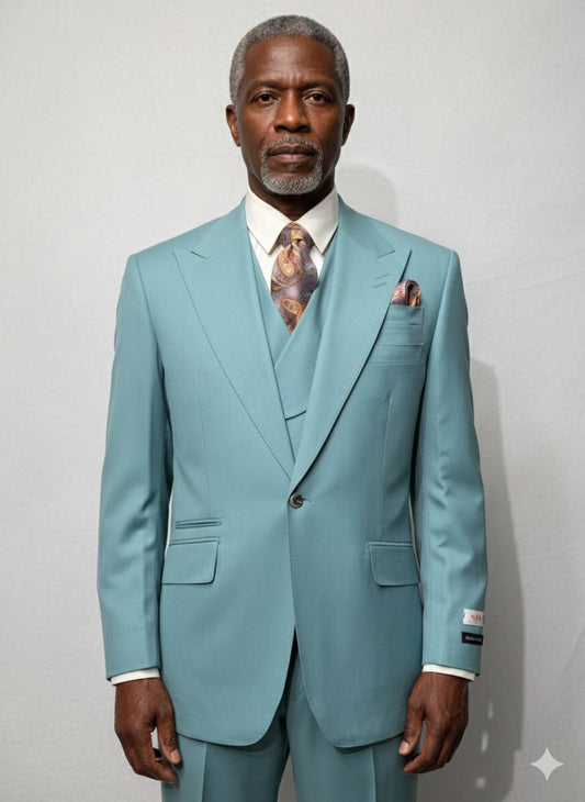 An older man faces forward in a Tiglio Rosso "New Rosso" SEA FOAM wide leg pure wool suit and vest (TL2651), paired with a patterned tie and pocket square, against a plain light background.