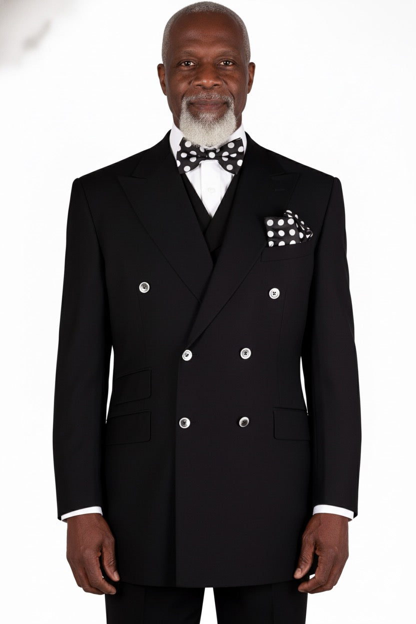 A sophisticated flair is offered by a Tiglio Rosso DB ESTE Solid Black TIG1001 suit, with a polka dot bow tie and pocket square, displayed on a mannequin.