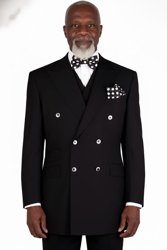 A sophisticated flair is offered by a Tiglio Rosso DB ESTE Solid Black TIG1001 suit, with a polka dot bow tie and pocket square, displayed on a mannequin.