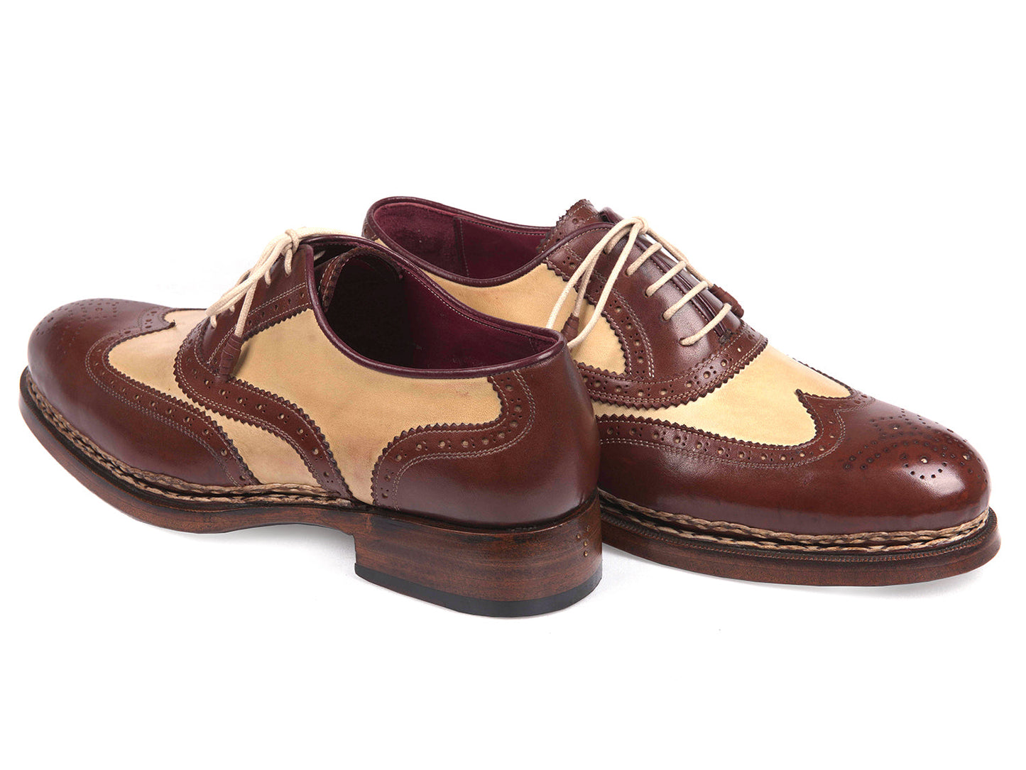The Paul Parkman Triple Leather Sole Goodyear Welted Wingtip Brogues - 095BEJ are dual-tone brown and beige calfskin shoes with lace-up closures, decorative perforations, and classic brogue detailing.