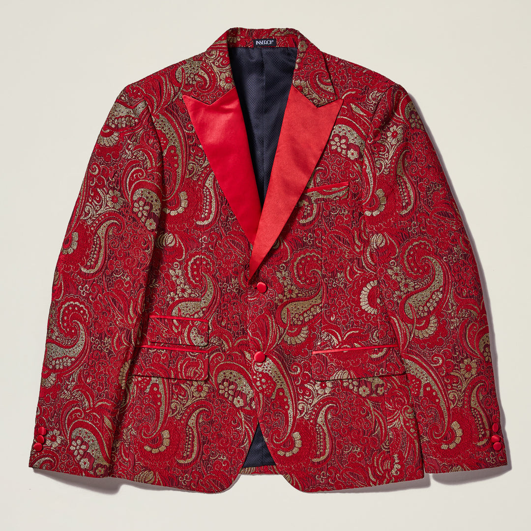 The Inserch Paisley Jacquard Blazer BL205-30 Red features a red paisley pattern with gold accents, red satin lapels, two buttons, three front pockets, and a slim fit. The blazer is shown laid flat on a white background.
