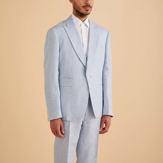 A man wearing the Inserch Linen Houndstooth Blazer BL269-00014 Lt. Blue by Inserch with a white dress shirt, standing against a plain beige background.