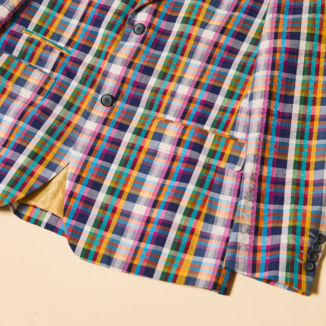 A person is wearing the Inserch Seersucker Madras Check Blazer BL276-00066 Multicolor over a white shirt with light blue pants, standing against a plain background.