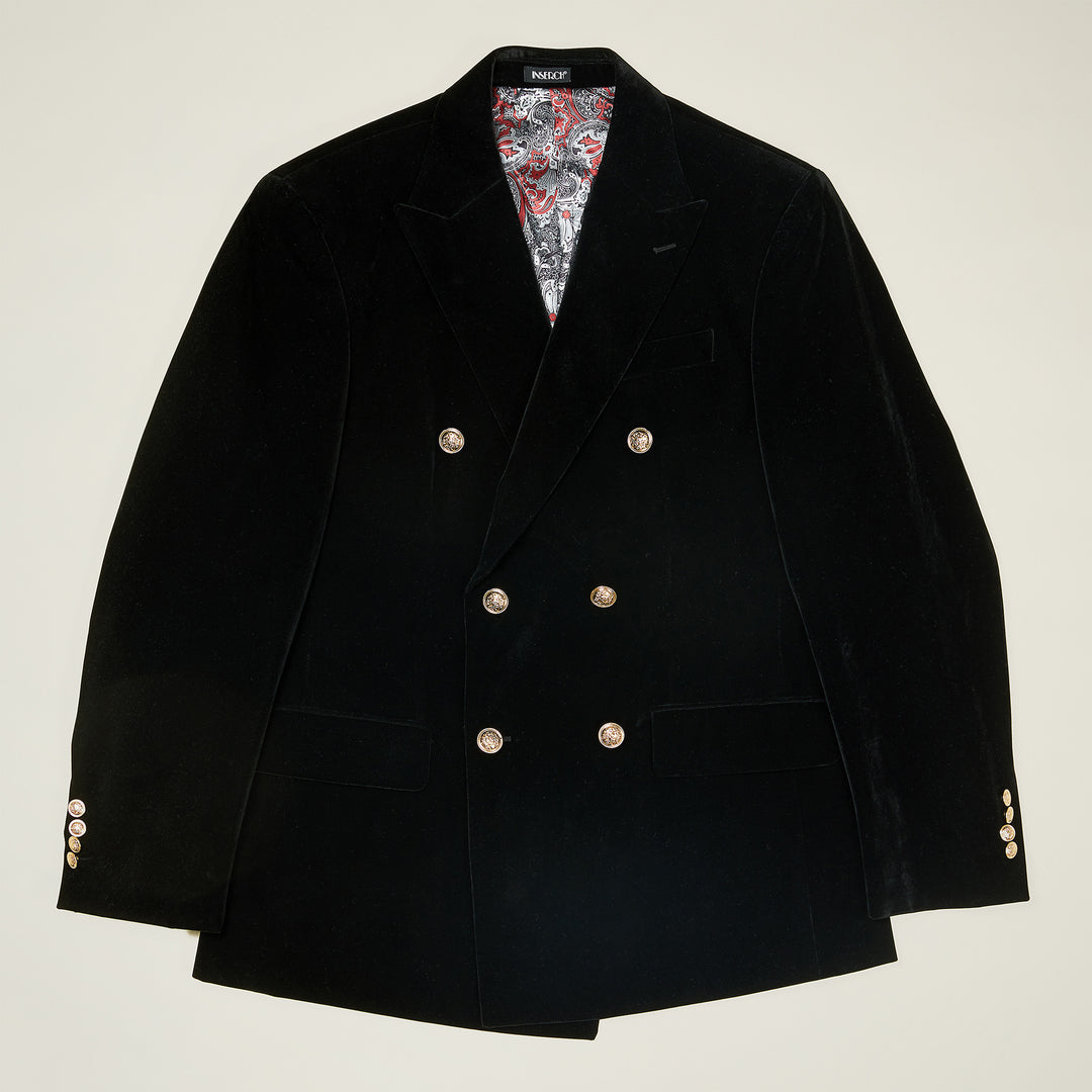 The Inserch DB Velvet Blazer BL502-00001 in black features a double-breasted design with military shank buttons, peaked lapels, front pockets, and a patterned inner lining, displayed flat against a light background.
