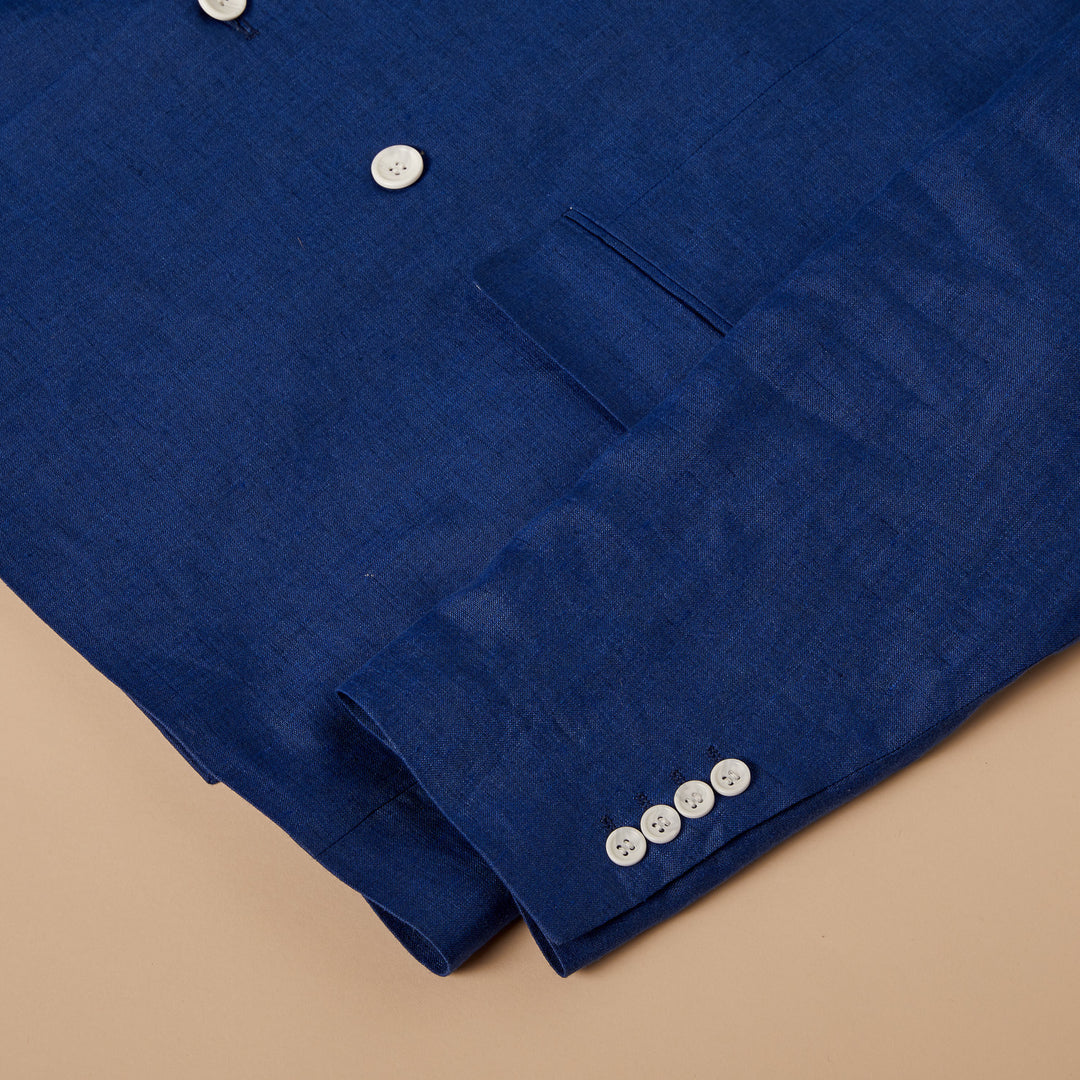 Close-up of the Inserch Classic DB Linen Blazers BL660 by Inserch, featuring beige woven fabric with a textured, slightly rough surface and visible weave pattern—ideal for a modern fit linen blazer. Available in 2 colors.